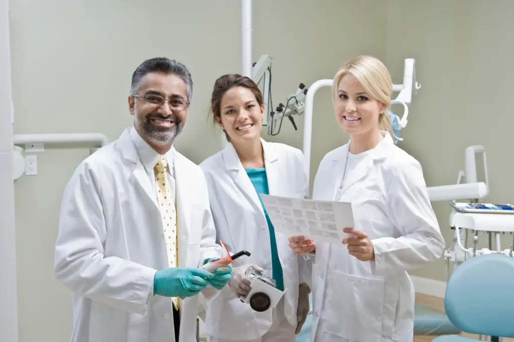 portrait of Zen Dental Marketing client dentists smiling in the dental room