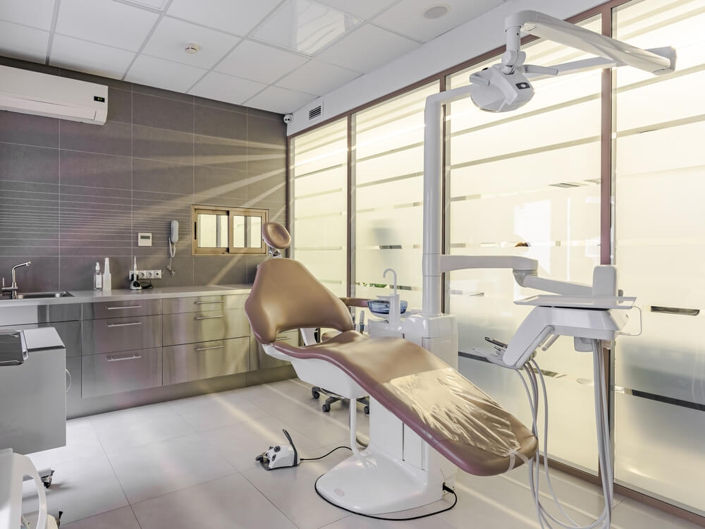 dental room with modern dental chair and equipment