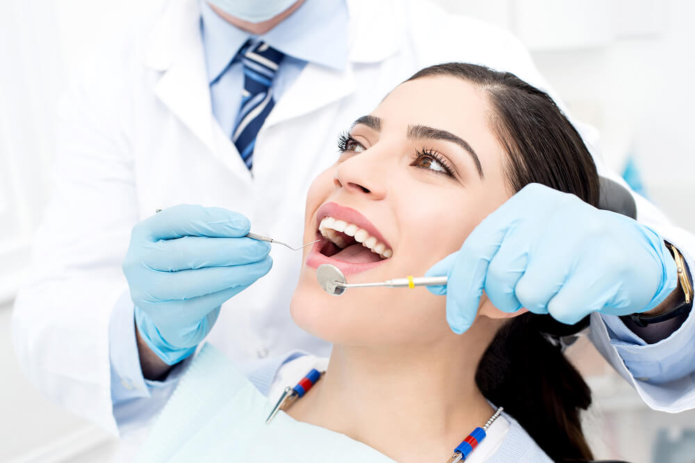 female patient receiving dental care 
