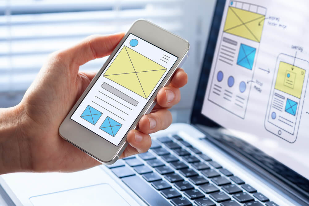 Image of a smartphone showing a mobile website design and development concept.