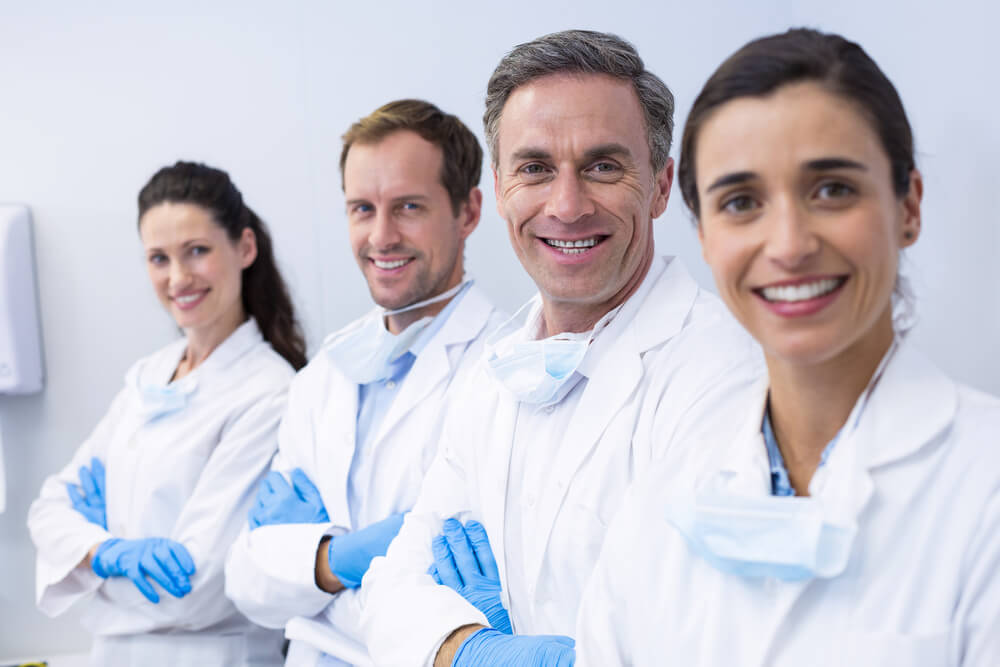 team of smiling dentists