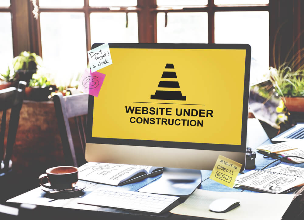 Picture of a computer screen showing a website under construction.